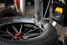 Mobile tire technician performing tire mounting, balancing & rotation